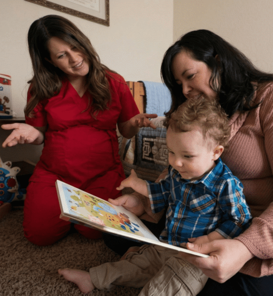 Nurses reading to child.